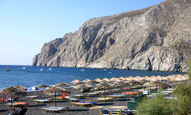 Kamari Beach lies under the Shadow of Mesa Vouno & Ancient Thira